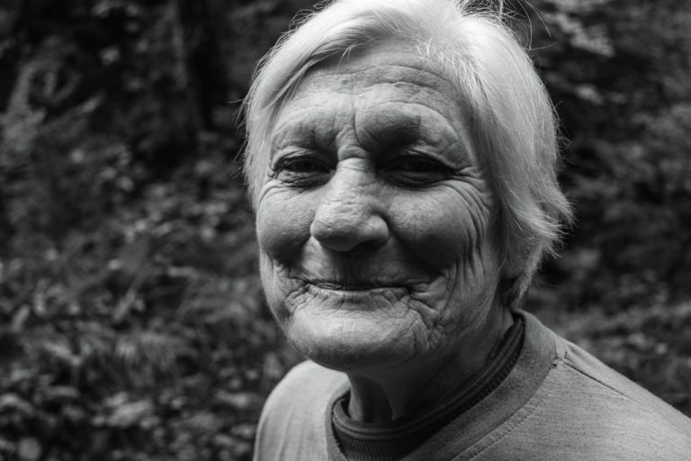 greyscale portrait of older woman