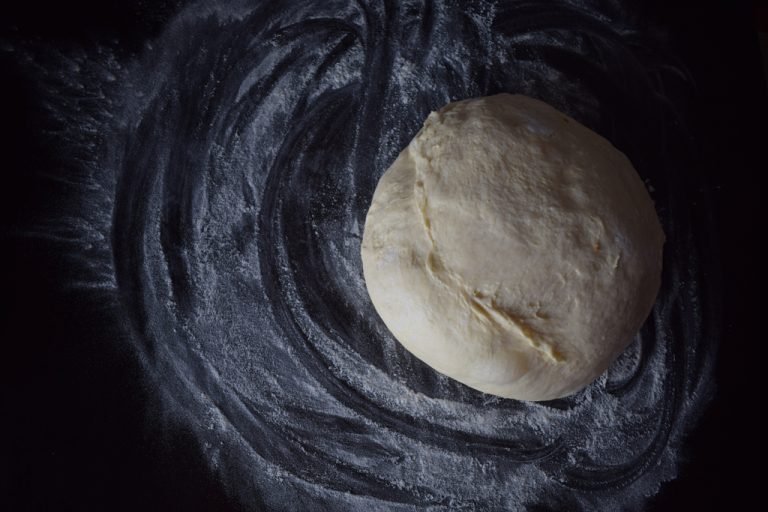 bread dough on a black background